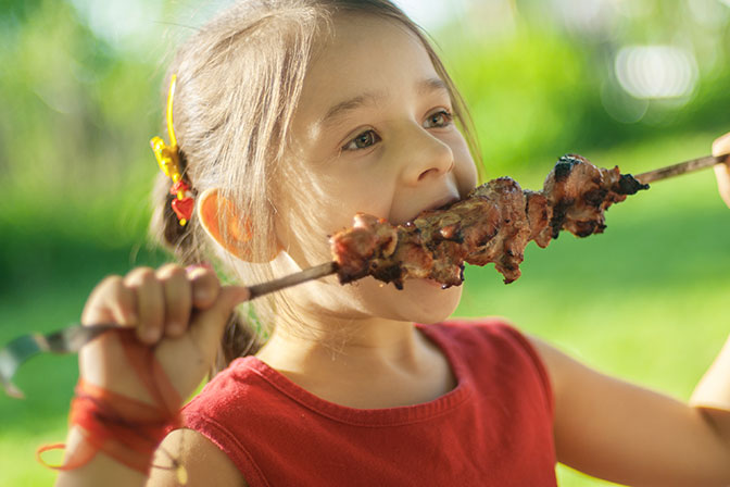Girl Eating a Kebab